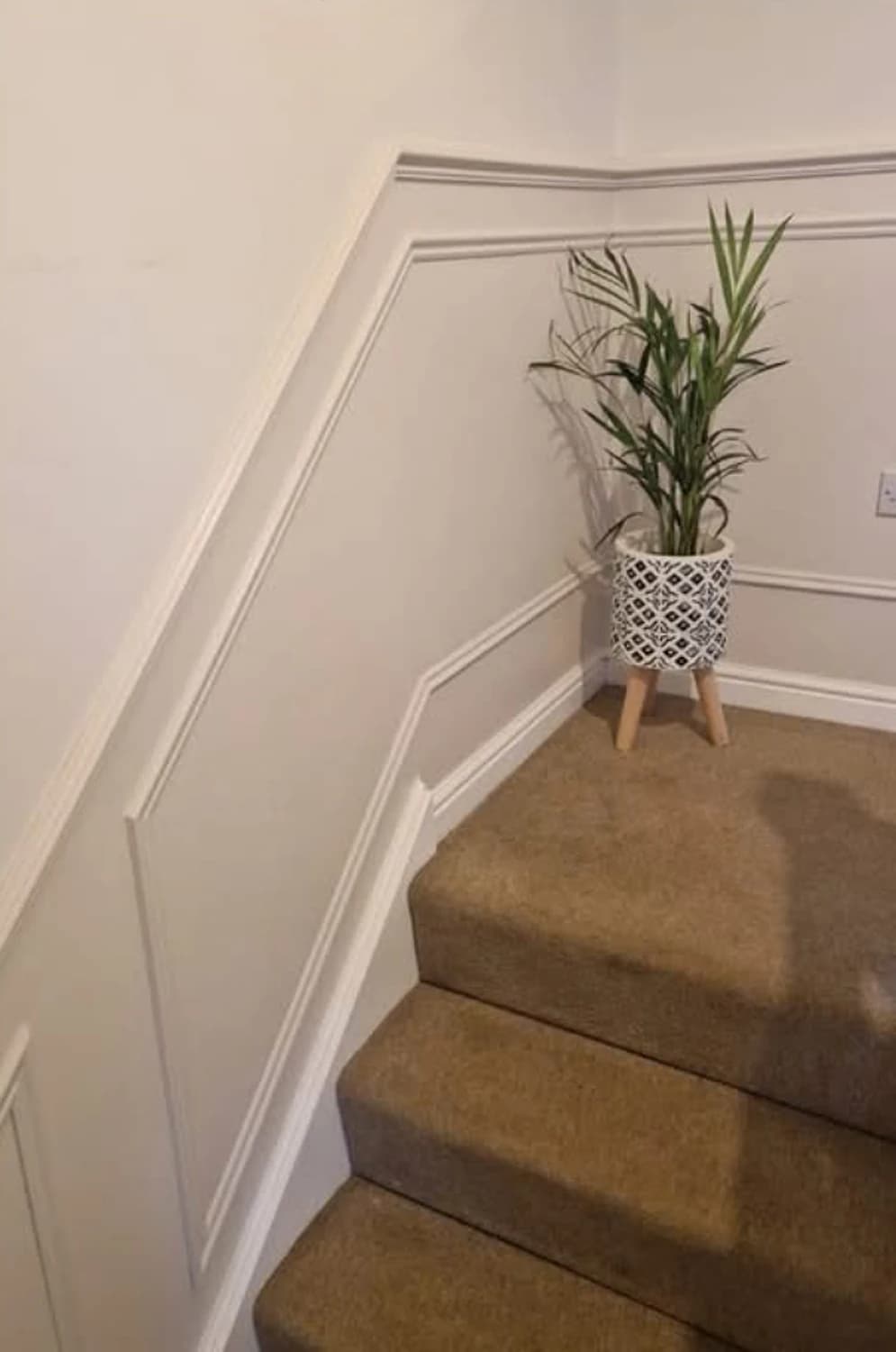 Close-up of mitred wall panelling detail on a landing